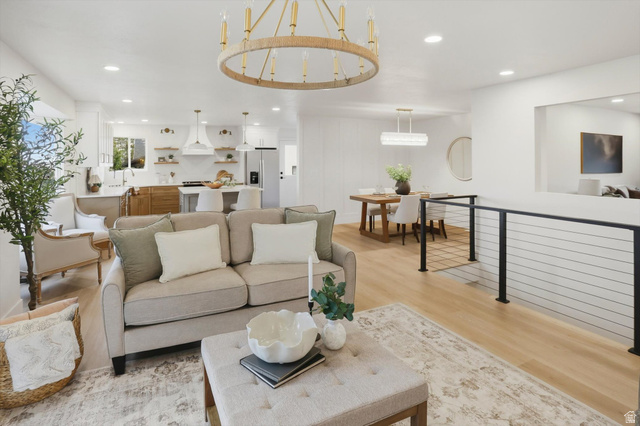 8760 Rustler Road Cottonwood Heights, UT 84093 - Photo 11 of 57 Open-concept living space featuring wood-finish flooring, a contemporary chandelier, and recessed lighting