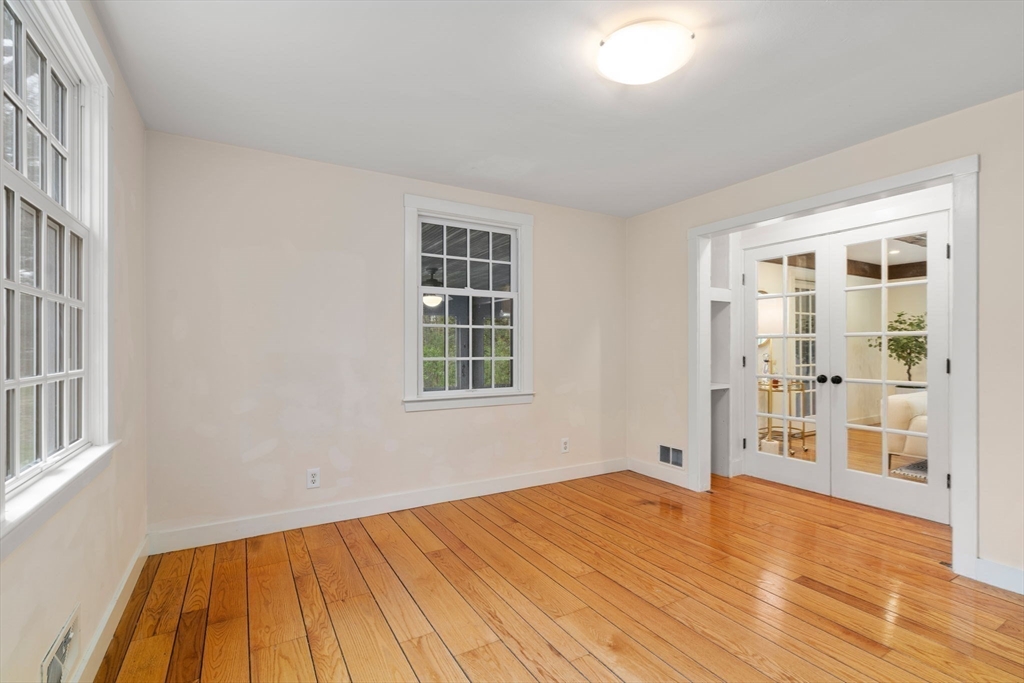 8 Todd Pond Road Lincoln, MA 01773 - Photo 13 of 29 an empty room with wooden floor and windows