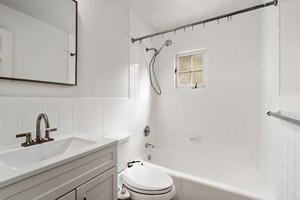 8 Todd Pond Road Lincoln, MA 01773 - Photo 14 of 29 a bathroom with a sink a toilet and a mirror