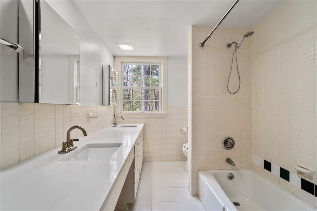 8 Todd Pond Road Lincoln, MA 01773 - Photo 20 of 29 a bathroom with a sink and a bathtub