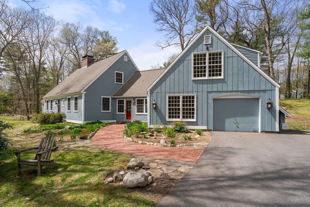 8 Todd Pond Road Lincoln, MA 01773 - Photo 2 of 29 a front view of a house with a yard and garage