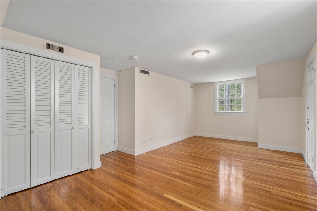 8 Todd Pond Road Lincoln, MA 01773 - Photo 21 of 29 a view of empty room with wooden floor and fan
