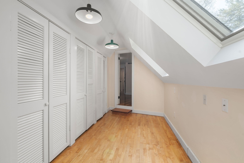 8 Todd Pond Road Lincoln, MA 01773 - Photo 22 of 29 a view of a hallway with wooden floor and staircase