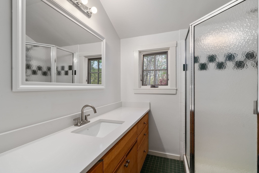 8 Todd Pond Road Lincoln, MA 01773 - Photo 23 of 29 a bathroom with a sink and a mirror