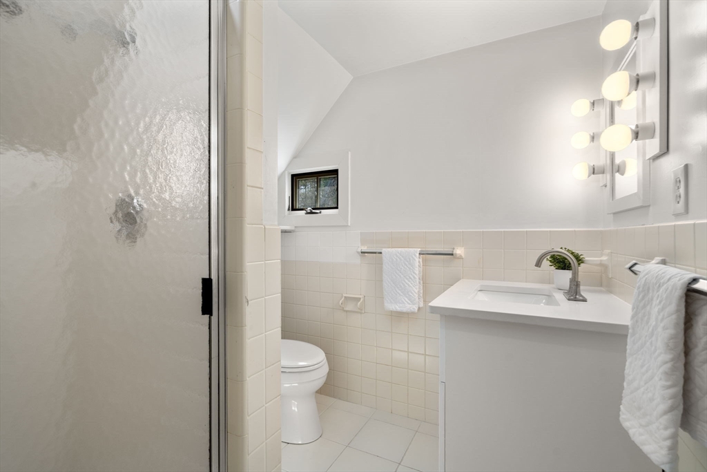 8 Todd Pond Road Lincoln, MA 01773 - Photo 28 of 29 a bathroom with a sink toilet and shower