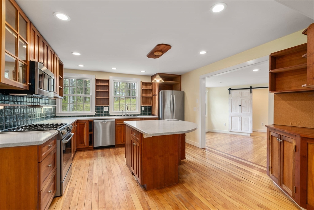 8 Todd Pond Road Lincoln, MA 01773 - Photo 5 of 29 a kitchen with stainless steel appliances granite countertop a stove and a refrigerator