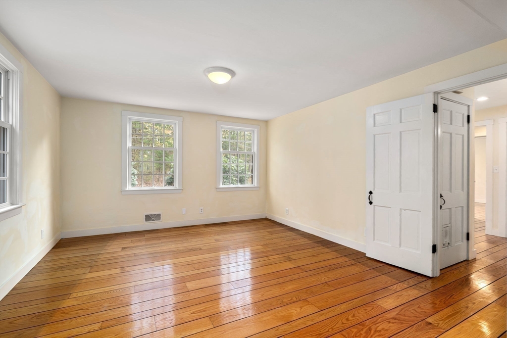 8 Todd Pond Road Lincoln, MA 01773 - Photo 8 of 29 a view of an empty room with wooden floor and a window