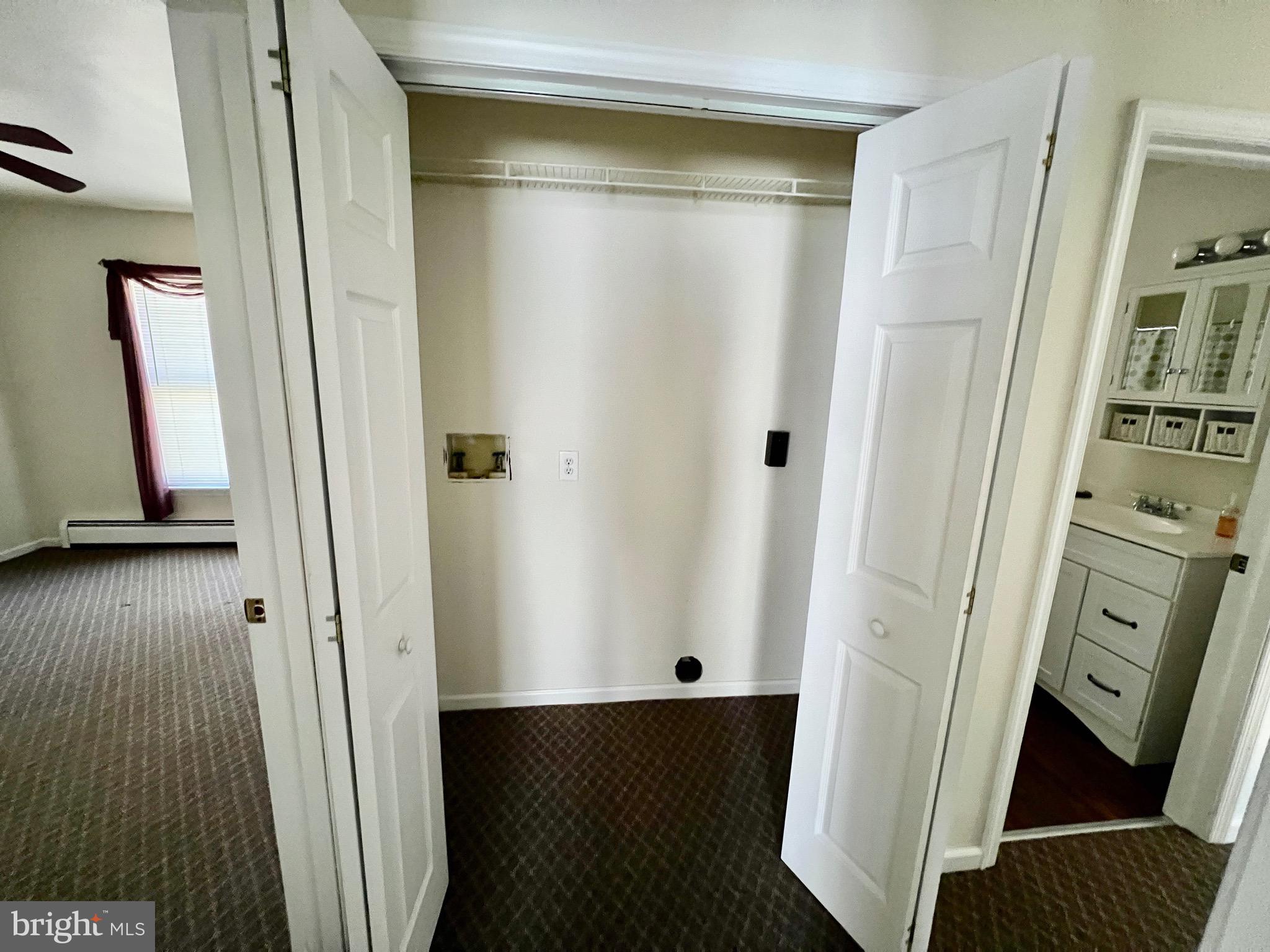 107 Centre Street Ashland, PA 17921 - Photo 16 of 32 a view of a hallway with wooden floor and closet