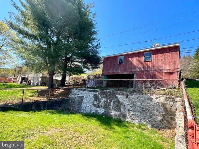 a view of swimming pool with a yard
