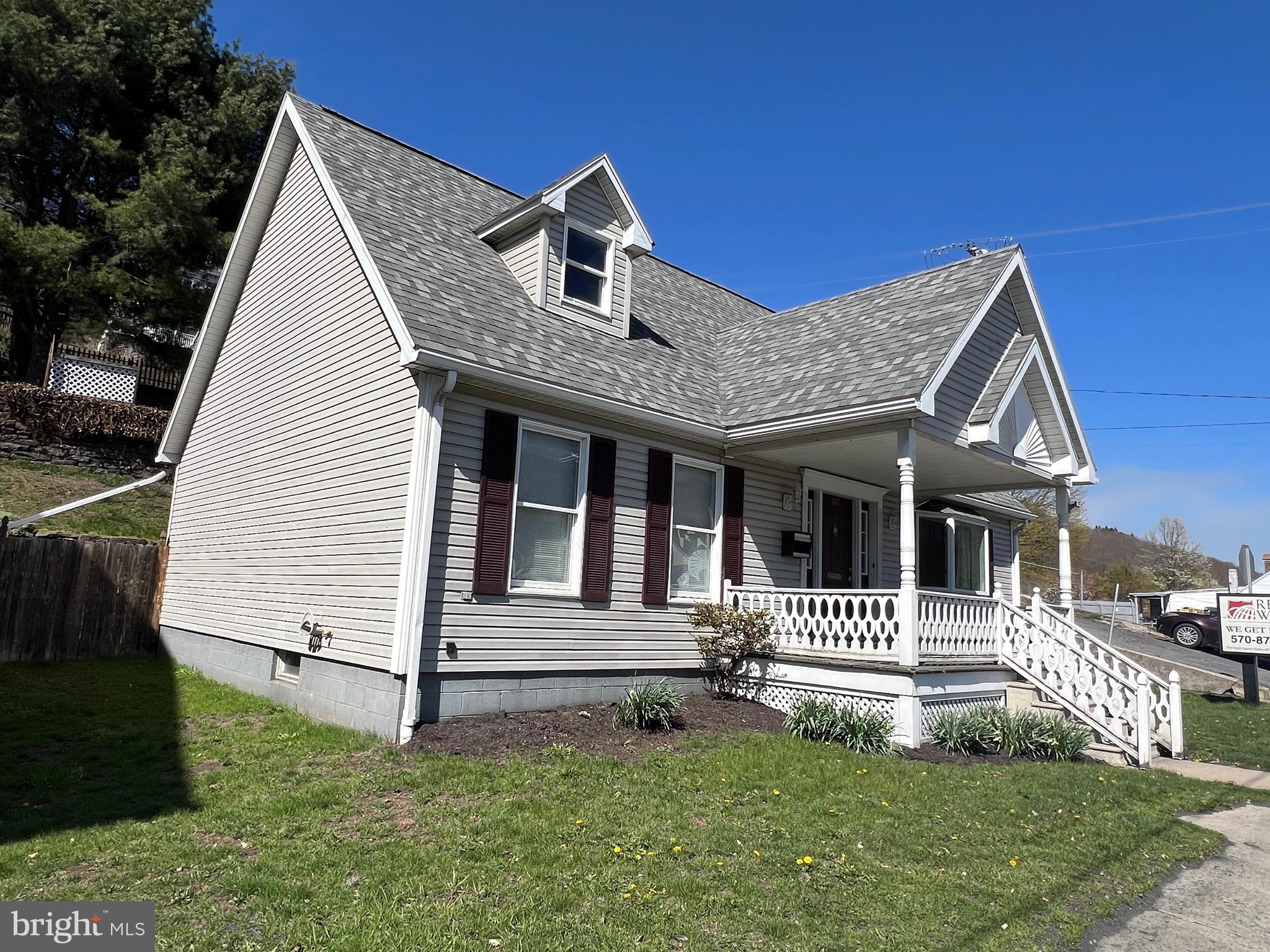 107 Centre Street Ashland, PA 17921 - Photo 3 of 32 a front view of a house with a garden