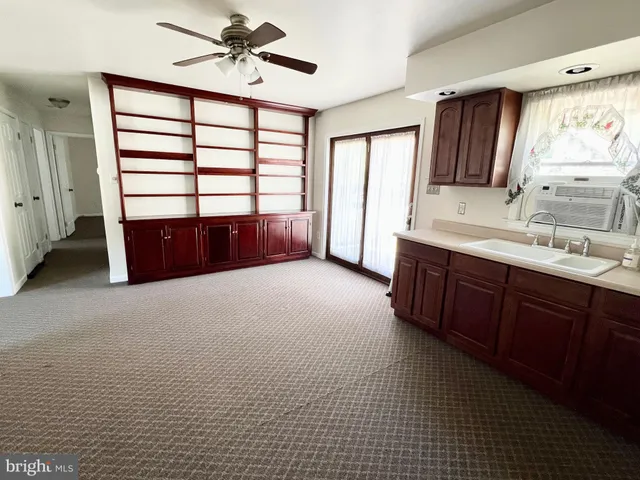 a spacious bathroom with a double vanity sink a mirror and a bathtub