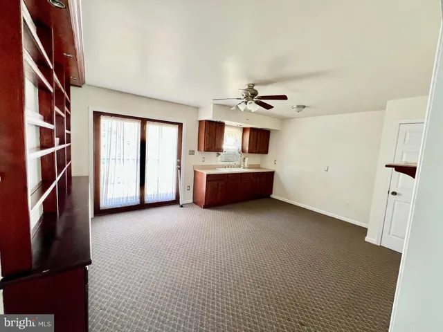 a view of livingroom with furniture and workspace