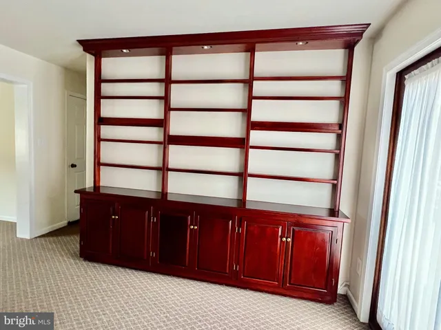 a view of a dresser in front of a door