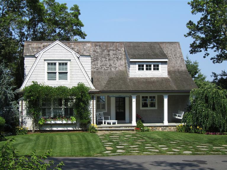 66 Tern Lane Centerville, MA 02632 - Photo 2 of 11 a front view of a house with a yard