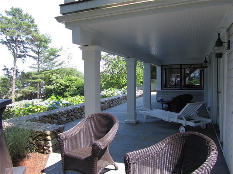 66 Tern Lane Centerville, MA 02632 - Photo 3 of 11 a view of a porch with furniture and a yard