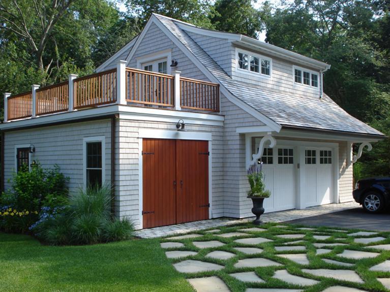 66 Tern Lane Centerville, MA 02632 - Photo 5 of 11 a front view of a house with a garden