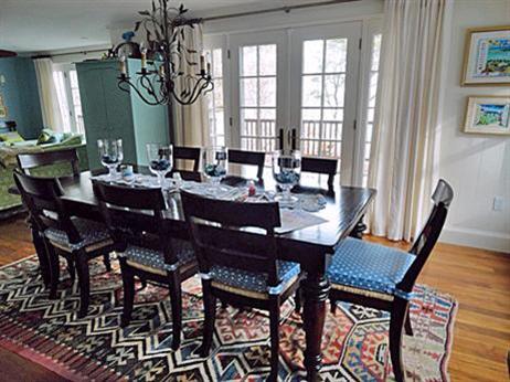 66 Tern Lane Centerville, MA 02632 - Photo 9 of 11 a view of a dining room with furniture window and wooden floor