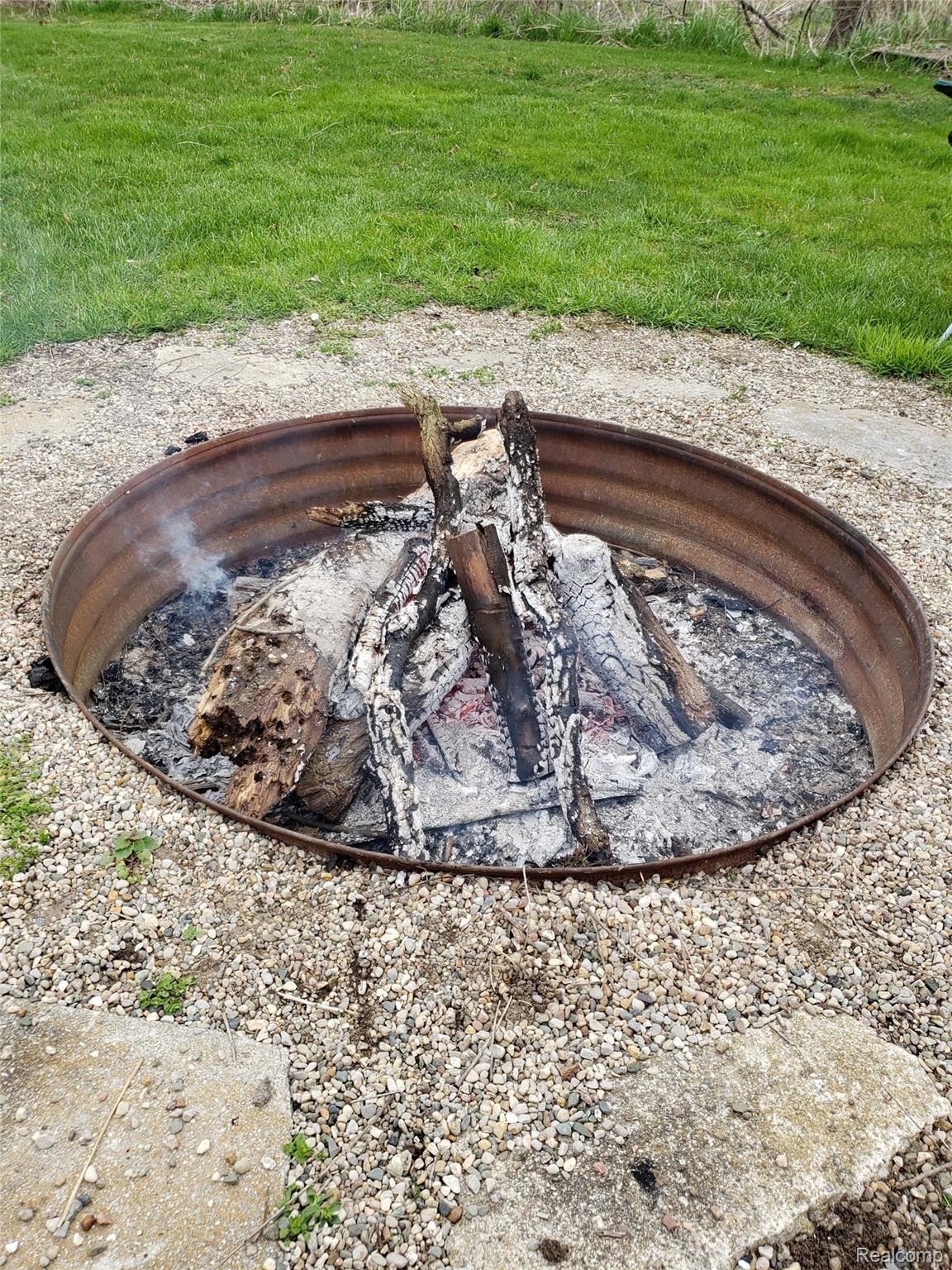 10310 Judd Road Fowlerville, MI 48836 - Photo 28 of 31 Campfire Pit
