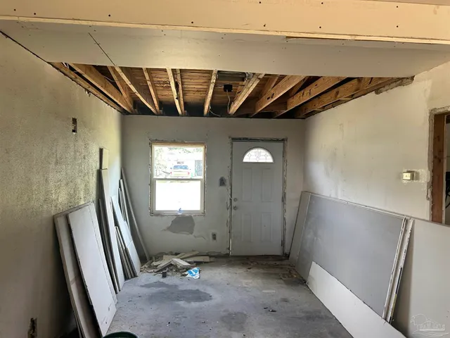 a view of a house with a backyard