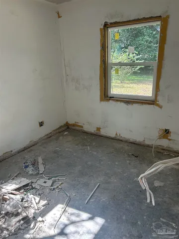 an empty room with windows