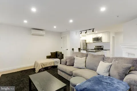 a kitchen with stainless steel appliances granite countertop a sink and a stove top oven with granite countertops