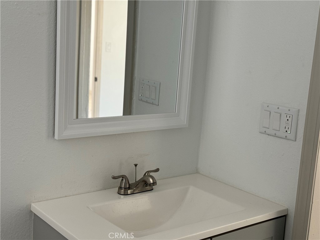 5263 35th Street Jurupa Valley, CA 92509 - Photo 14 of 19 a bathroom with a sink