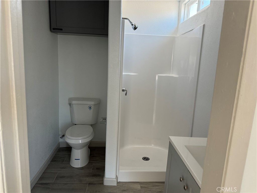 5263 35th Street Jurupa Valley, CA 92509 - Photo 17 of 19 a bathroom with a sink and a toilet