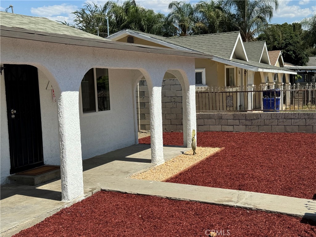 5263 35th Street Jurupa Valley, CA 92509 - Photo 4 of 19 a view of a white house with large windows