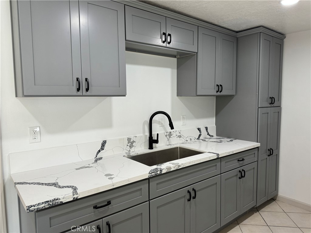 5263 35th Street Jurupa Valley, CA 92509 - Photo 10 of 19 a kitchen with a sink and cabinets