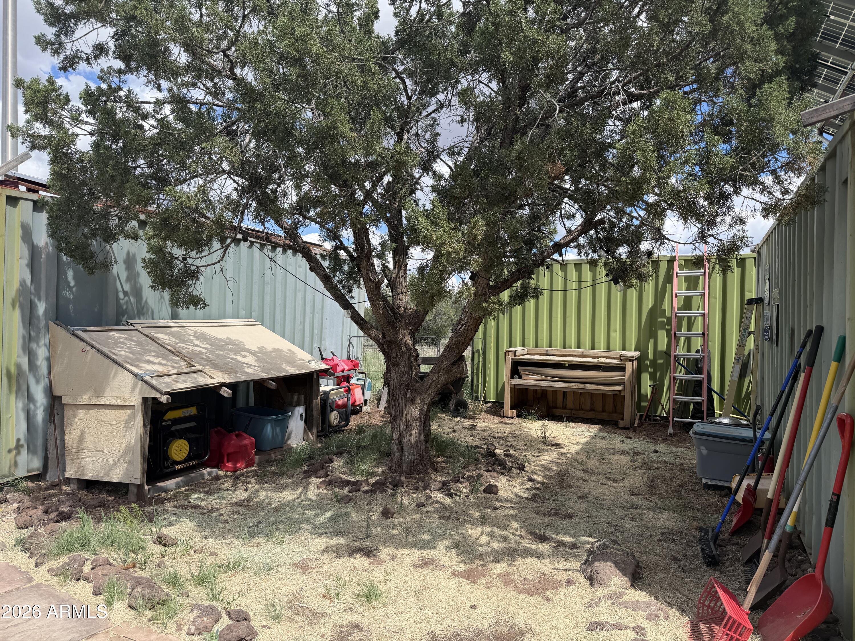 1 Hideaway Road Ash Fork, AZ 86320 - Photo 23 of 43 a view of a house with a backyard and wooden fence