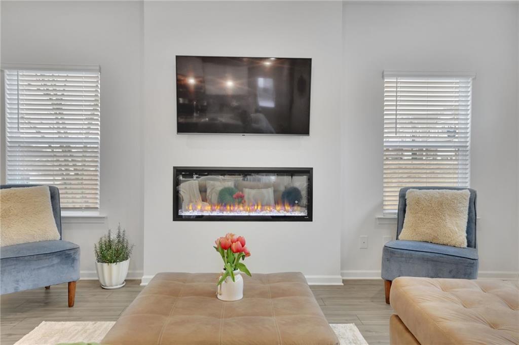 803 Dundee Way Cartersville, GA 30121 - Photo 16 of 37 a living room with furniture and a flat screen tv