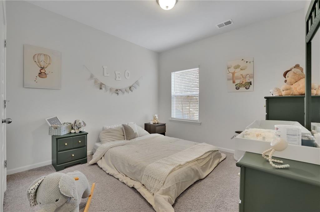 803 Dundee Way Cartersville, GA 30121 - Photo 18 of 37 a bedroom with a bed and a window