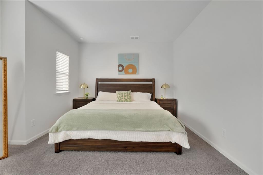 803 Dundee Way Cartersville, GA 30121 - Photo 24 of 37 a bedroom with a bed and window