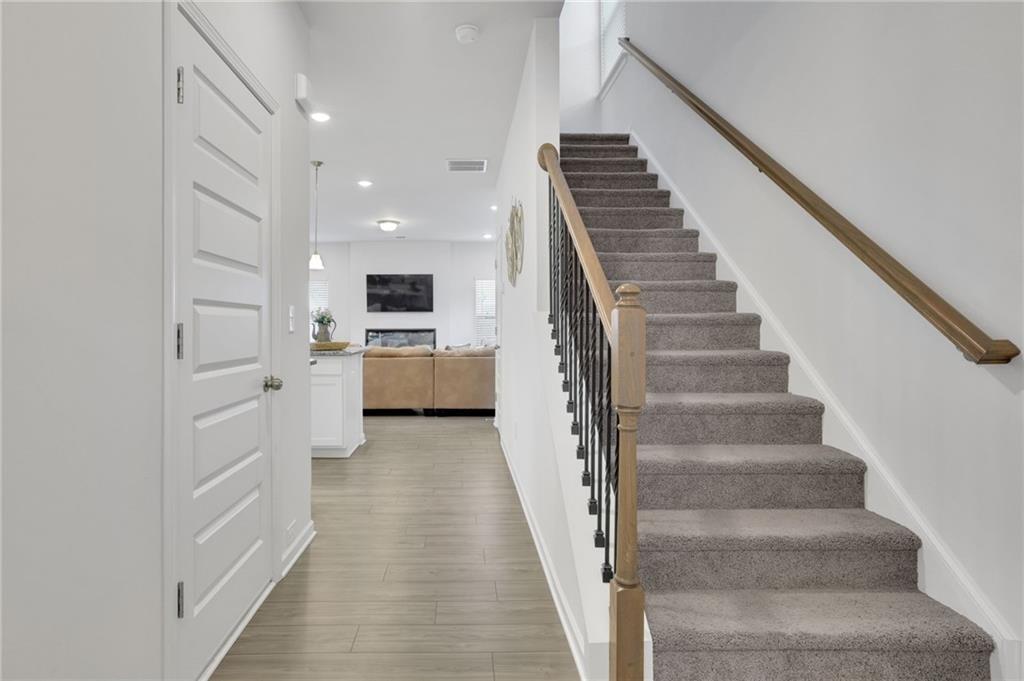 803 Dundee Way Cartersville, GA 30121 - Photo 3 of 37 a view of a hallway with the wooden floor and staircase