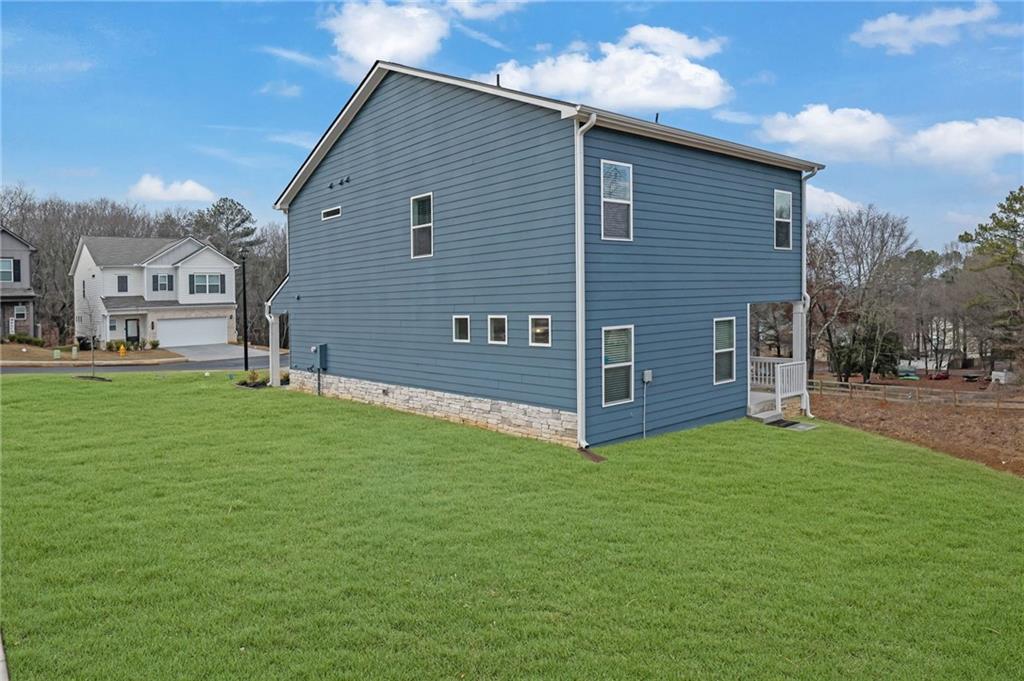 803 Dundee Way Cartersville, GA 30121 - Photo 32 of 37 a view of a house with a yard