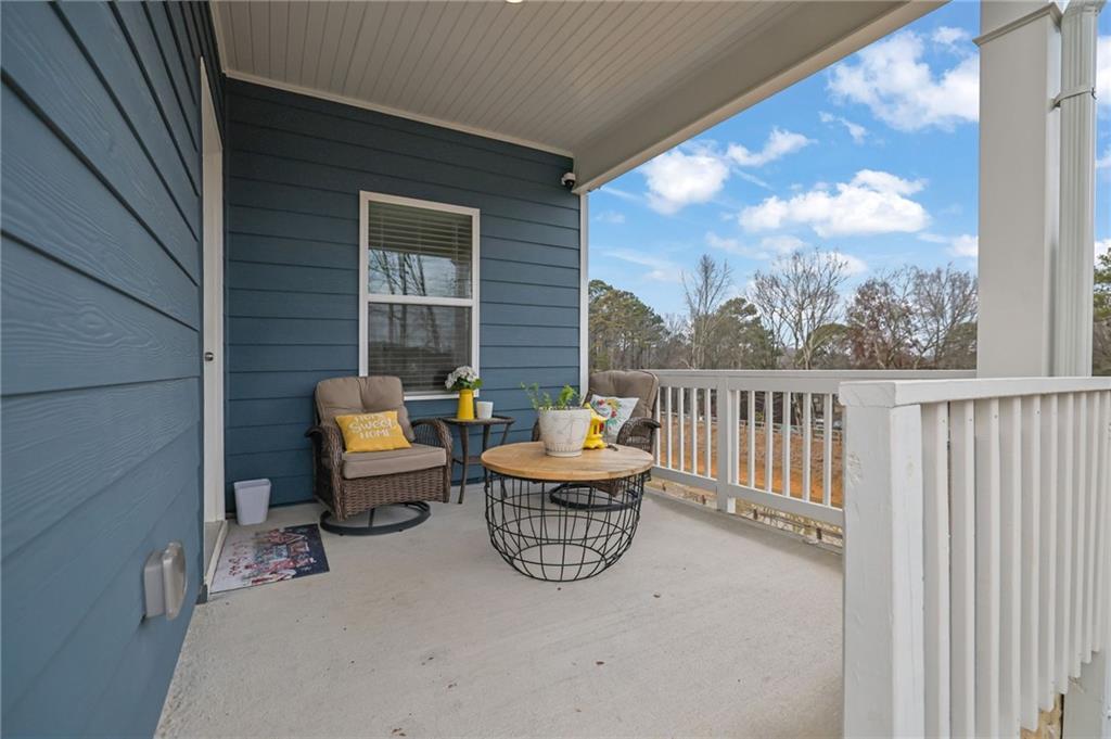803 Dundee Way Cartersville, GA 30121 - Photo 33 of 37 a view of a chair and tables back yard of the house
