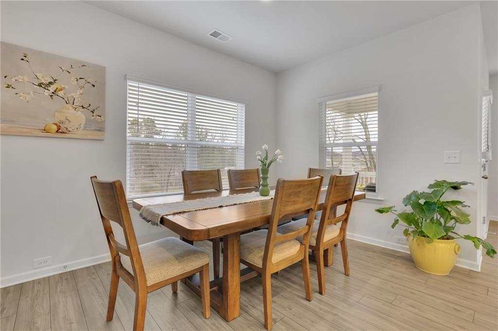 803 Dundee Way Cartersville, GA 30121 - Photo 9 of 37 a dining room with furniture and wooden floor