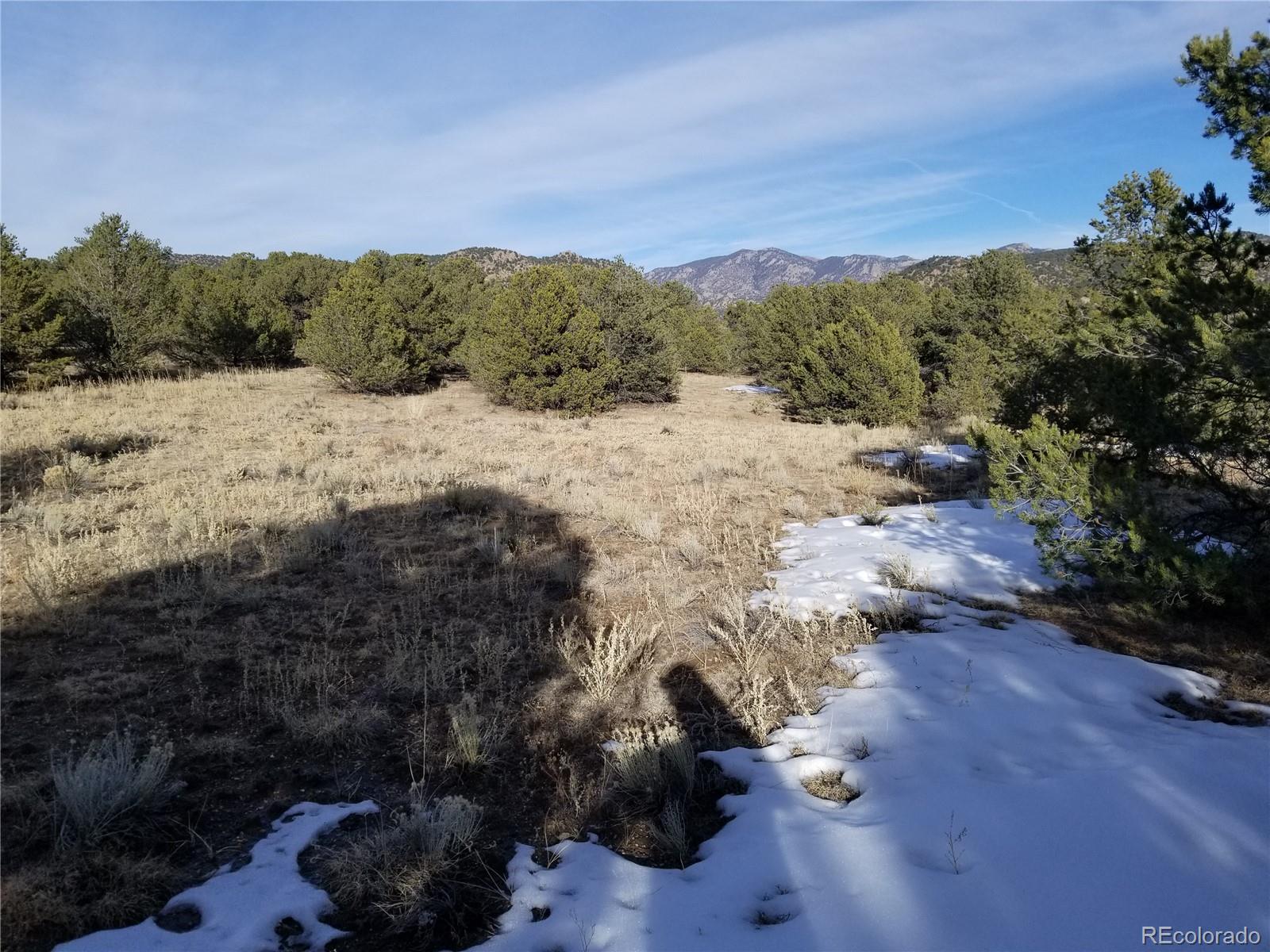 10761 Sawatch Range Road Salida, CO 81201 - Photo 15 of 36 a view of a lake with mountains in the background
