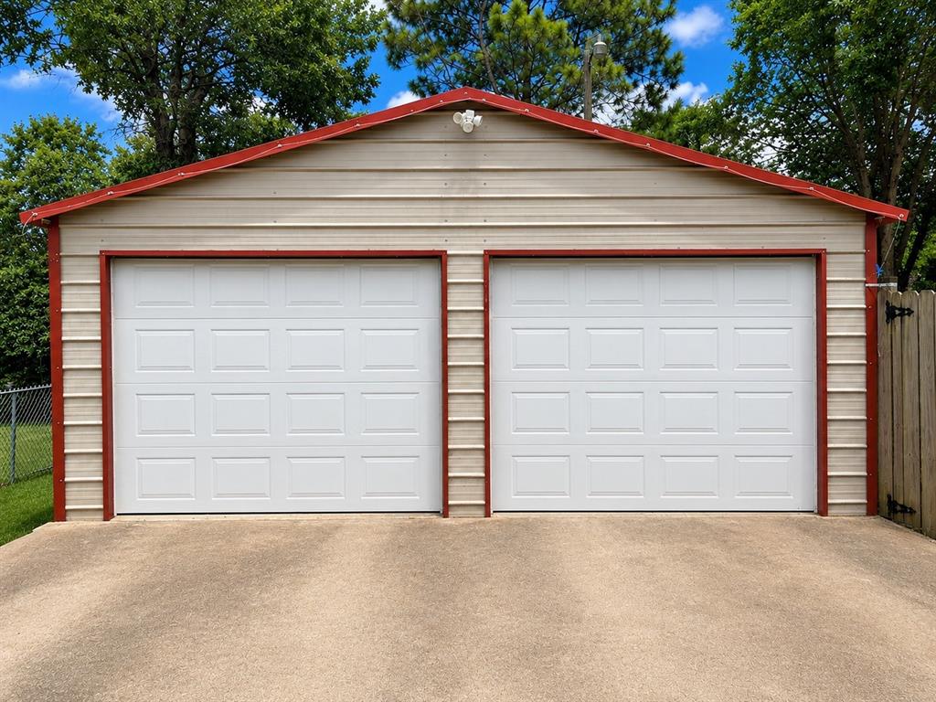409 Poe Street Quitman, TX 75783 - Photo 17 of 19 Garage with Garage Door Openers