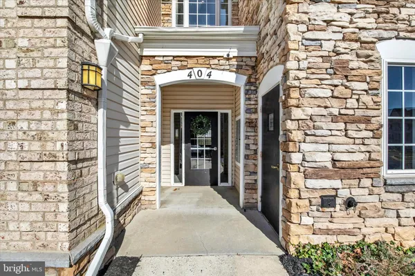 a view of a building with a door and a window
