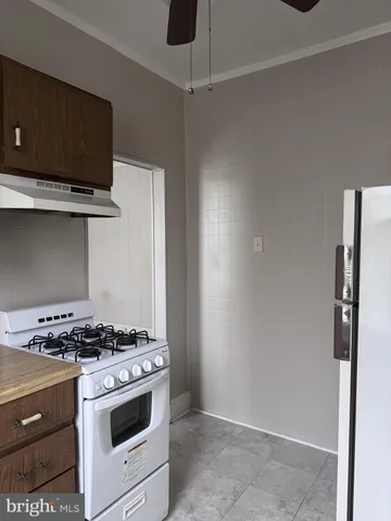 a kitchen with stainless steel appliances a stove and a refrigerator