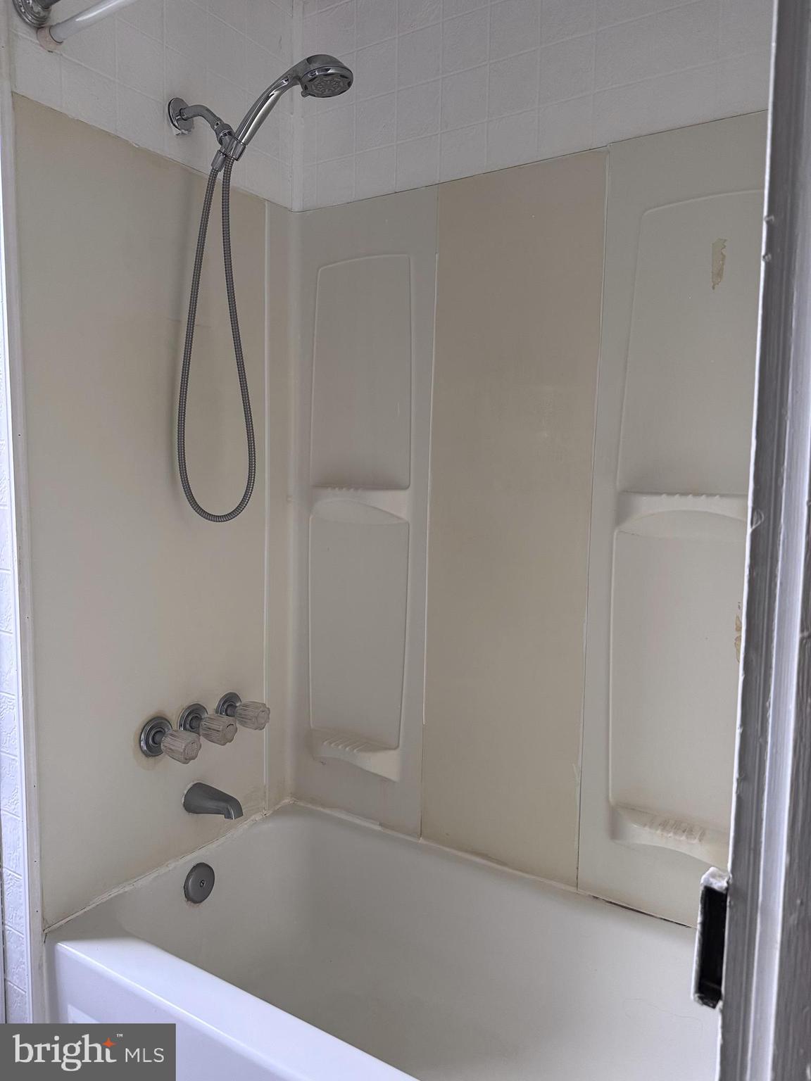 4606 Ridge Avenue Halethorpe, MD 21227 - Photo 18 of 24 a bathroom with a bath tub and shower