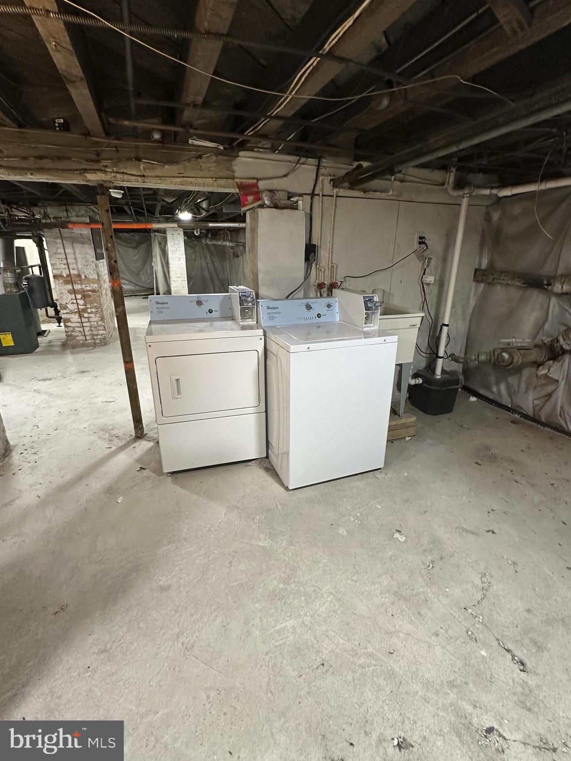 4606 Ridge Avenue Halethorpe, MD 21227 - Photo 7 of 24 a utility room with dryer and washer