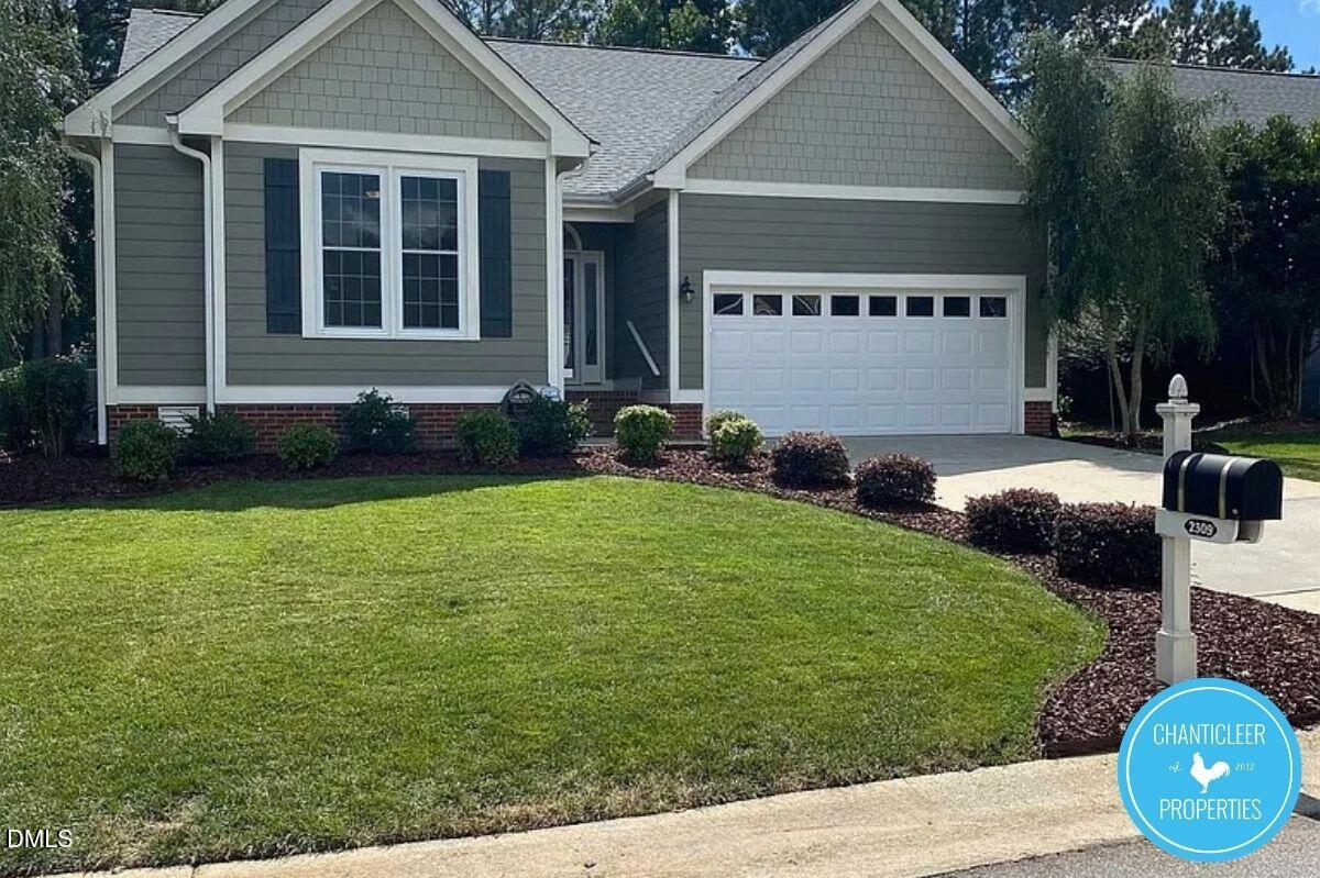 2309 Kendricks Court Raleigh, NC 27613 - Photo 38 of 38 a front view of a house with garden