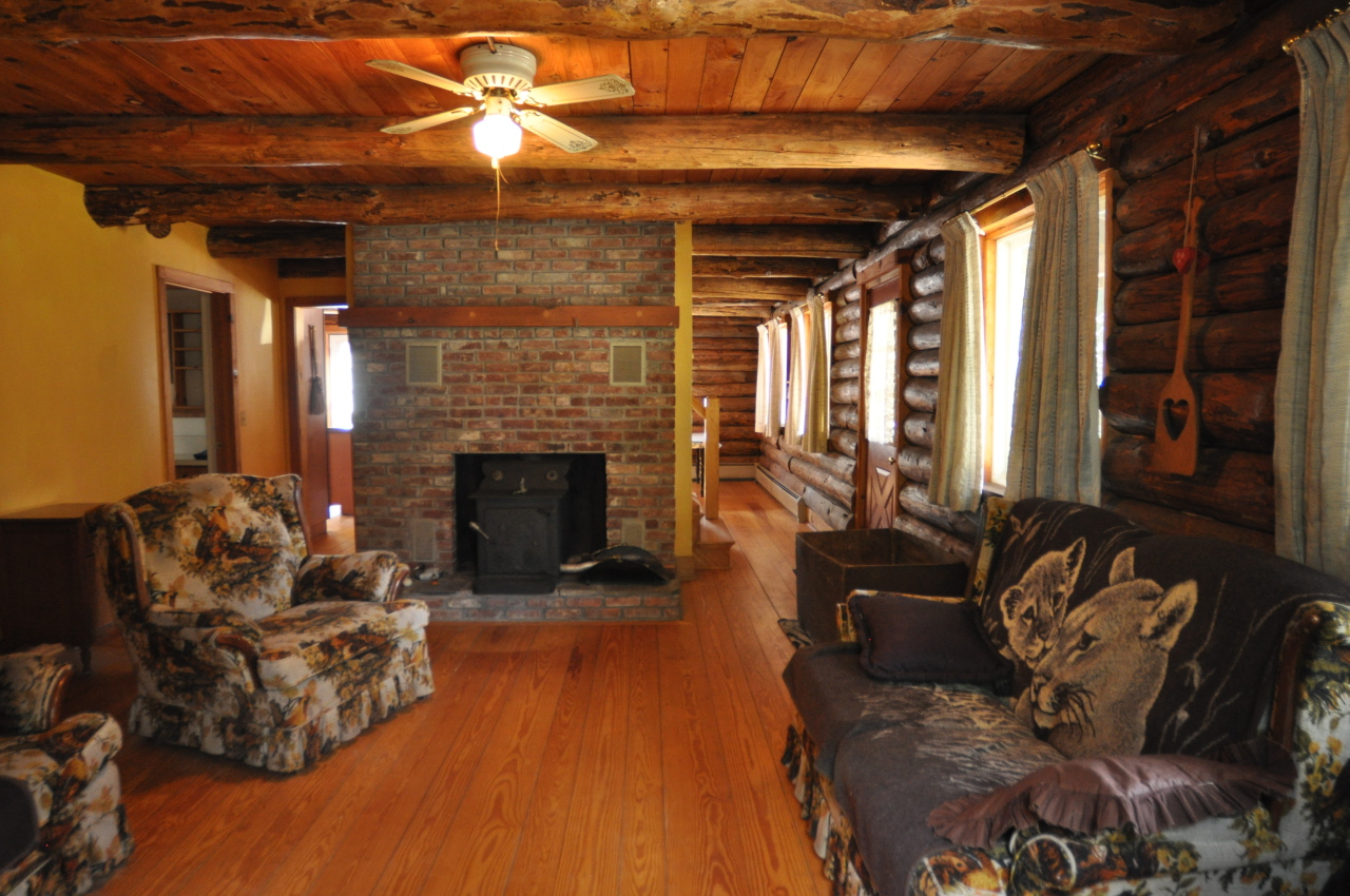 401 Polikoff Road Sheffield, MA 01222 - Photo 4 of 17 a living room with furniture and a fireplace
