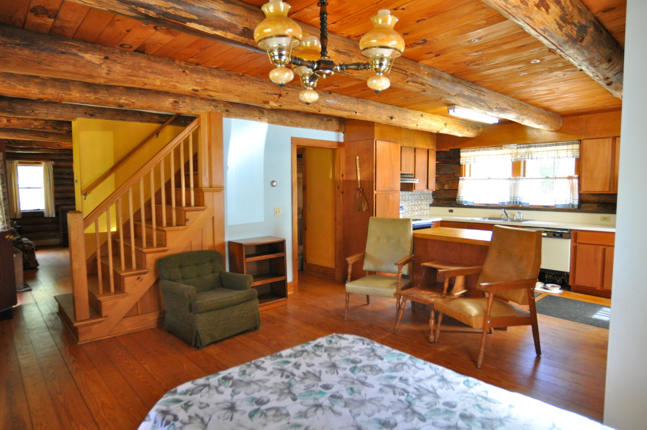 401 Polikoff Road Sheffield, MA 01222 - Photo 5 of 17 a living room with furniture and a dining table with wooden floor