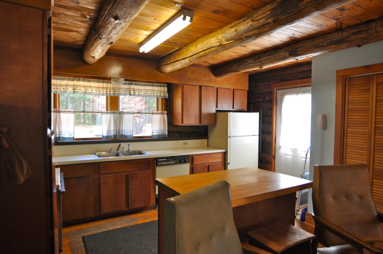 401 Polikoff Road Sheffield, MA 01222 - Photo 7 of 17 a dining hall with stainless steel appliances granite countertop a sink a stove a refrigerator a dining table and chairs with wooden floor