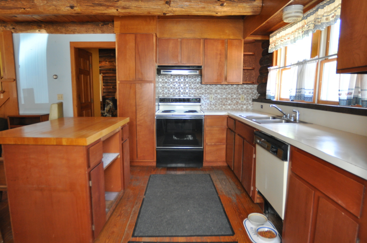 401 Polikoff Road Sheffield, MA 01222 - Photo 8 of 17 a kitchen with granite countertop a sink stove and cabinets