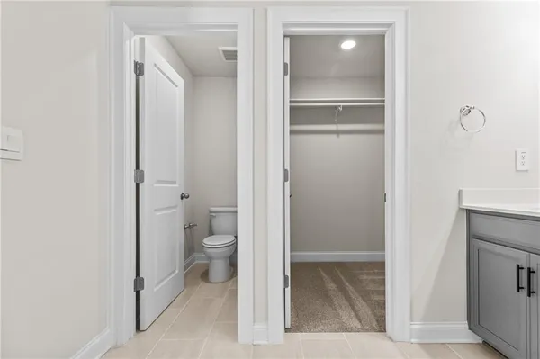 a bathroom with a shower sink and mirror