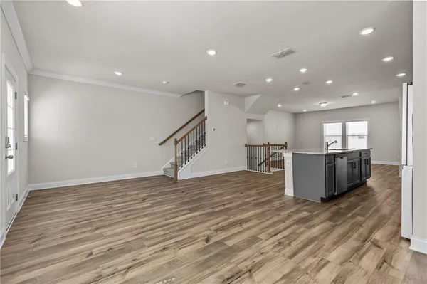 a view of a kitchen and a wooden floor